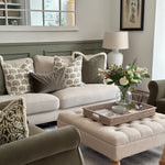 Lucia White Ceramic Table Lamp with beaded detailing and linen shade styled in living room