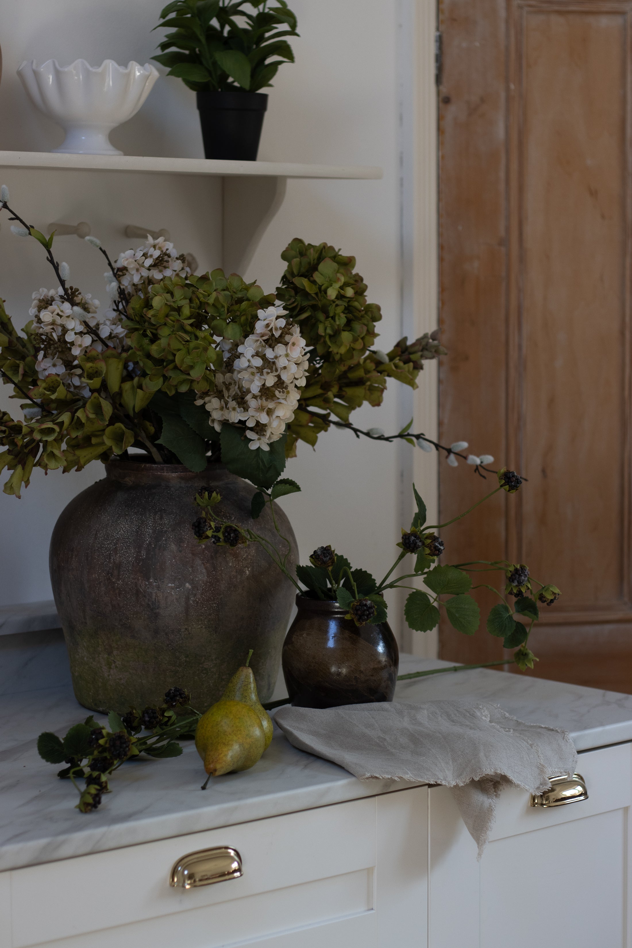 Three stems of lifelike Pussy Willow stems with green leaves