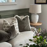 Lucia White Ceramic Table Lamp with beaded detailing and linen shade styled in living room