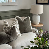 Lucia White Ceramic Table Lamp with beaded detailing and linen shade styled in living room