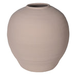 A large round beige vase filled with a narrow opening