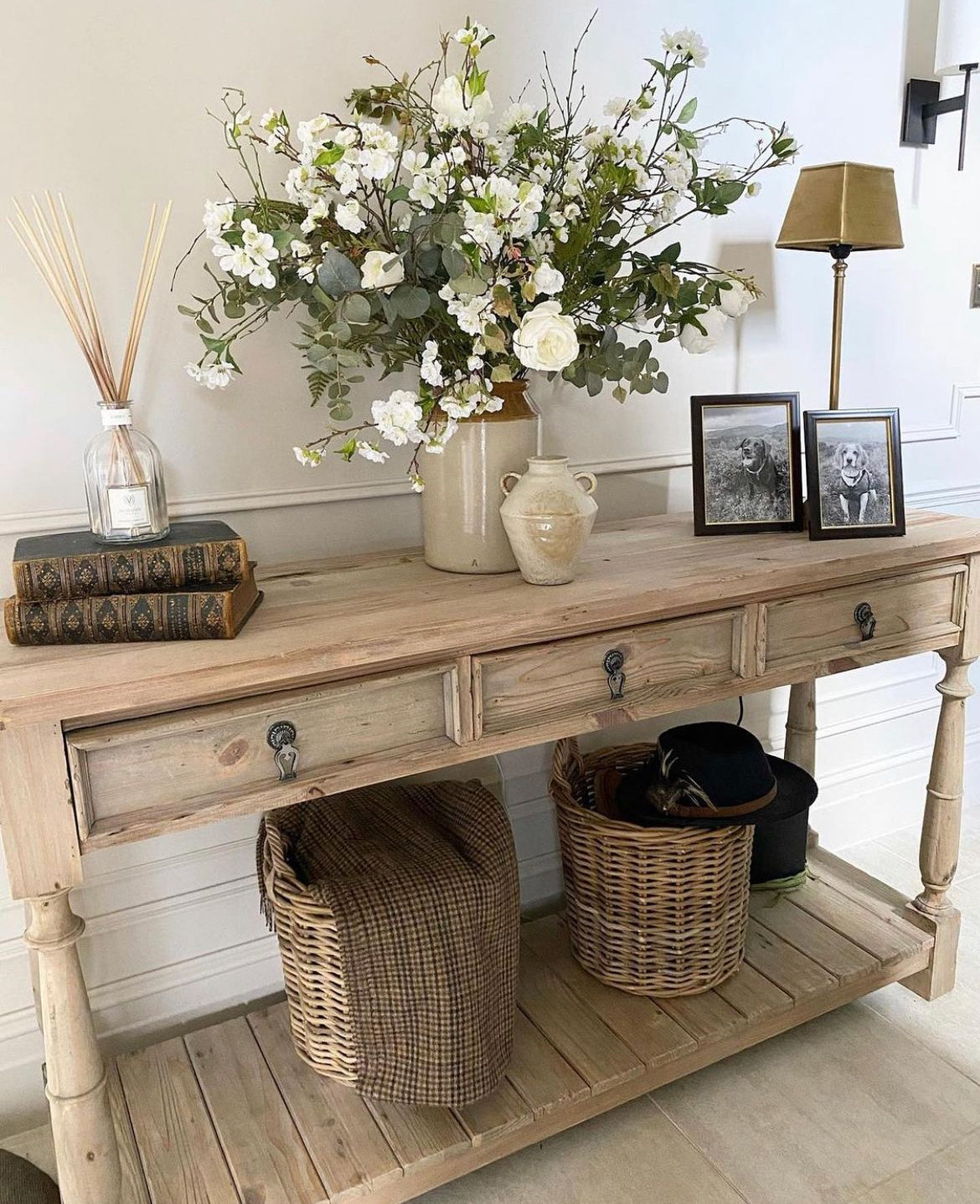 Three-drawer console table made from reclaimed, weathered pine