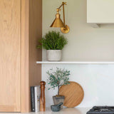 faux rosemary bush in stone pot