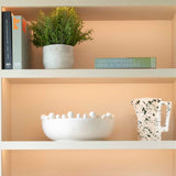 faux rosemary bush in stone pot