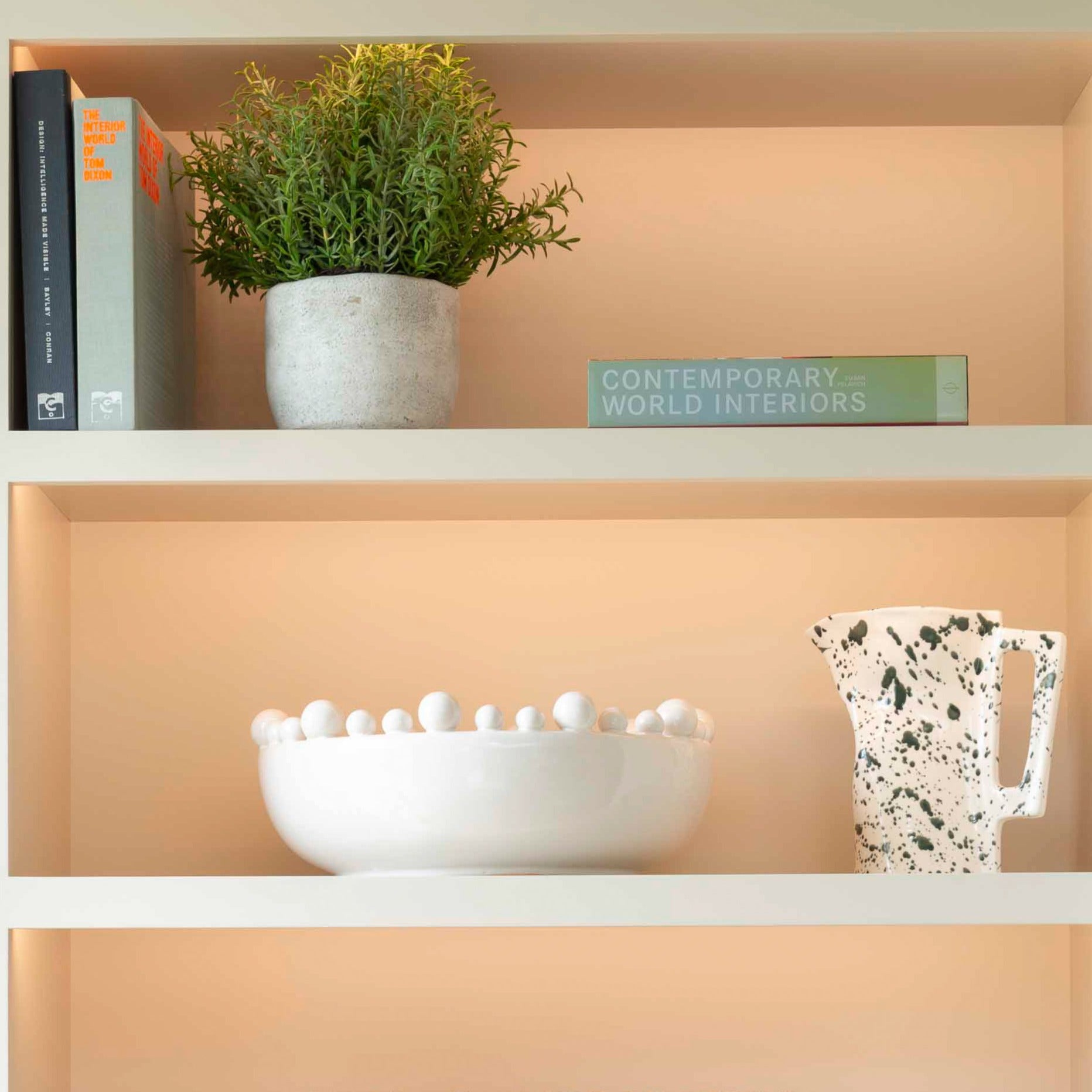 faux rosemary bush in stone pot