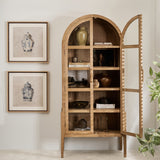 Arched natural elm wood display cabinet with glass doors and five interior shelves, styled with ceramic vases and books in a modern living space