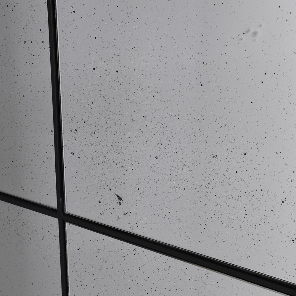 Close-up of antiqued glass detail on Arched Grid Mirror showing aged texture.