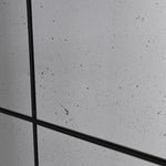 Close-up of antiqued glass detail on Arched Grid Mirror showing aged texture.