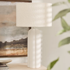 Arlo Bouclé Table Lamp with tall matte ceramic base and textured fabric shade on console table