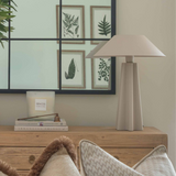 Modern beige metal table lamp in a living room setting