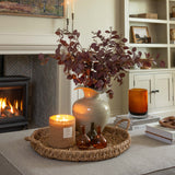 Living room with fireplace, candle, and decorative items