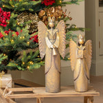 Decorated Christmas tree with red bows and ornaments in a living room.