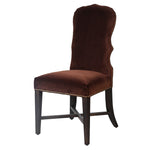 Brown velvet dining chair with curved back and dark wood legs