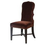 Brown velvet dining chair with curved back and dark wood legs