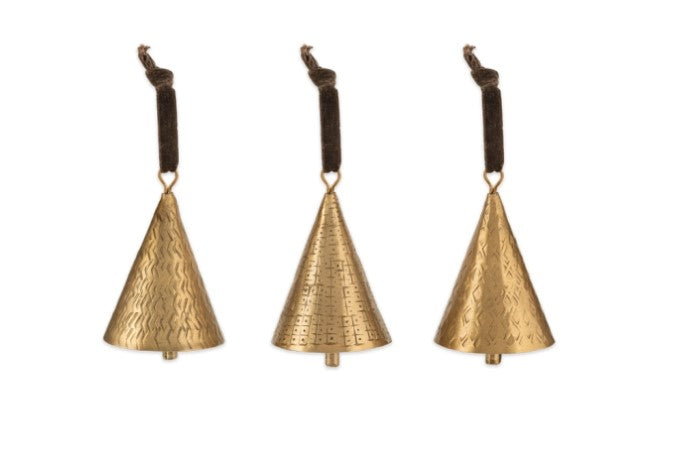 Charles Ted Artisan Brass Bell Baubles with hand-hammered patterns and velvet ties displayed on a white surface
