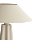 Beige table lamp with a white shade on a white background