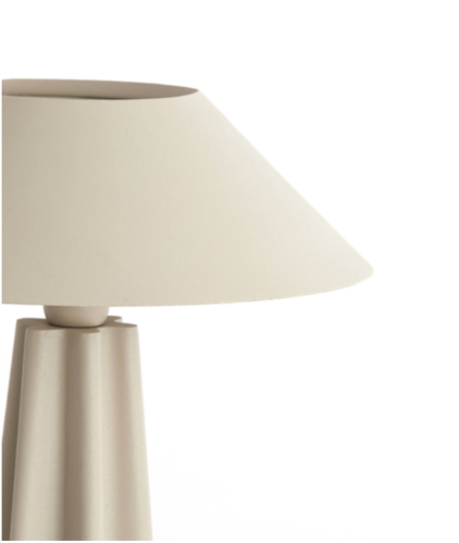 Beige table lamp with a white shade on a white background