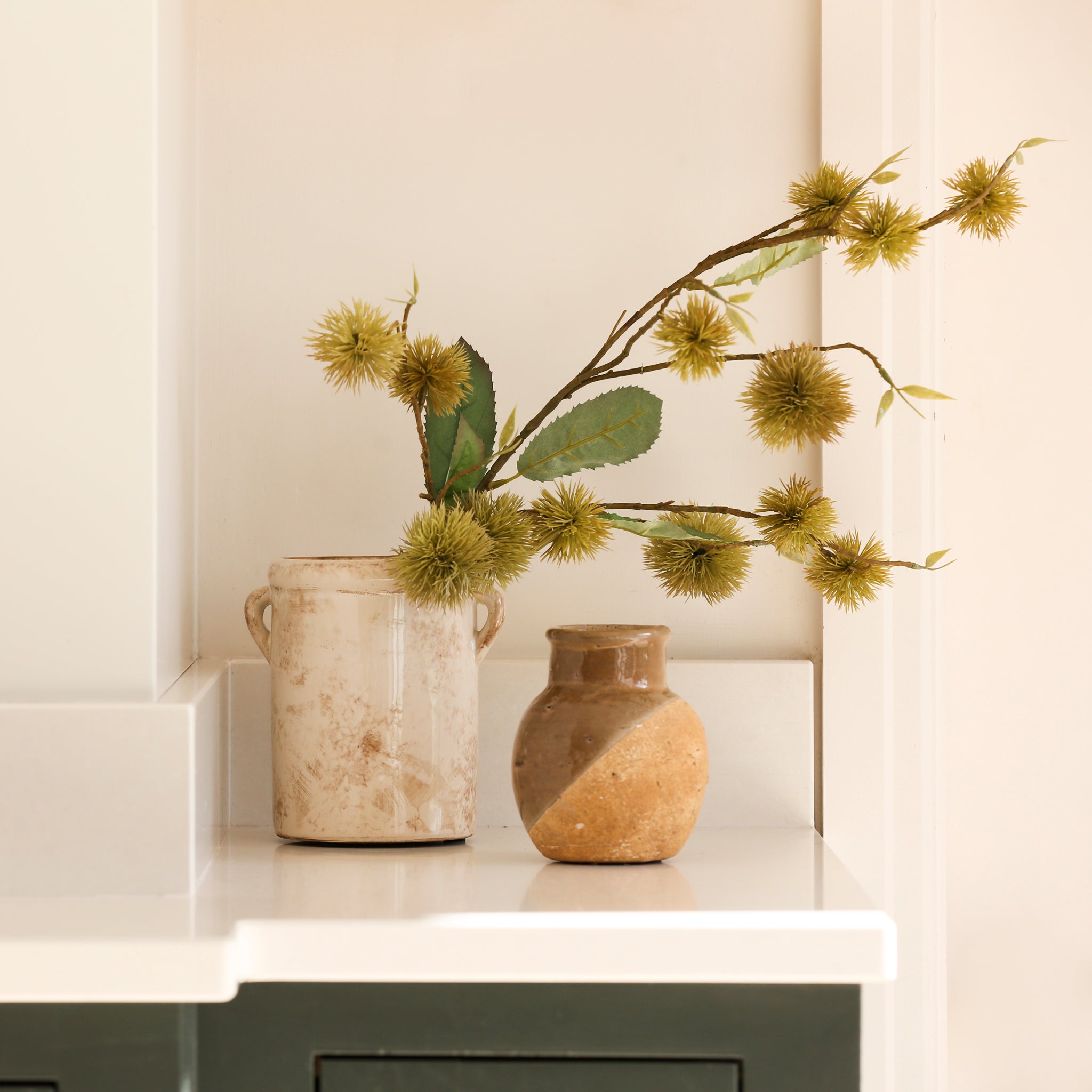 Charles Ted Chestnut Spray on display in ceramic vase