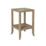 A stunning end table crafted in aged oak featuring a glass top, tapered legs and a shelf underneath.