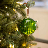 Charles Ted Green Glass Ribbed Baubles hanging on a Christmas tree