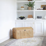 Rattan storage trunk styled in living room corner