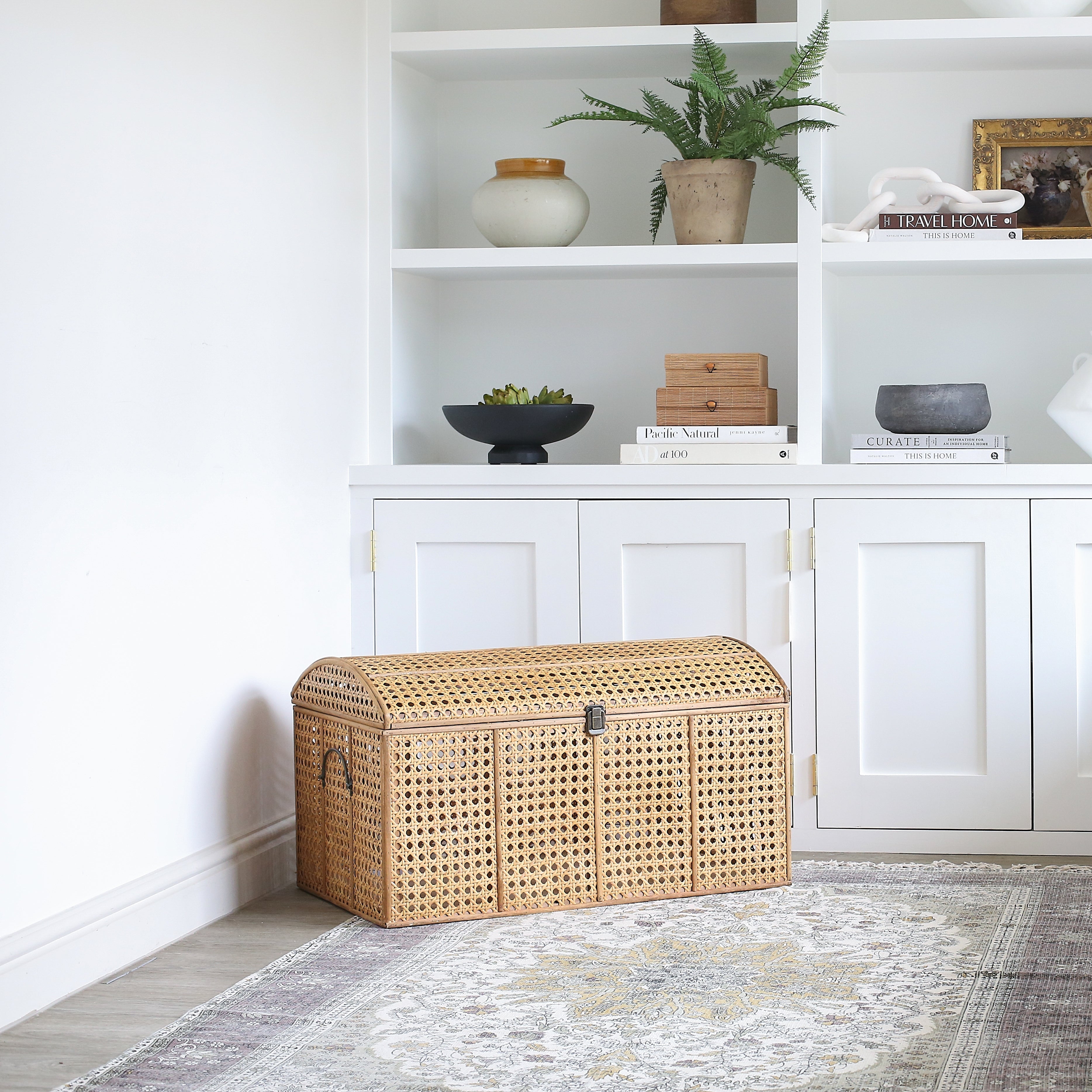 Rattan storage trunk styled in living room corner
