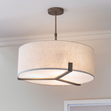 Modern ceiling pendant light with linen shade and bronze metalwork