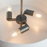 Modern ceiling light fixture with three adjustable arms on a neutral background