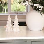 Charles Ted Lit Decorative Christmas Tree styled on a counter next to a festive floral arrangement