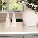 Charles Ted Lit Decorative Christmas Tree styled on a counter next to a festive floral arrangement