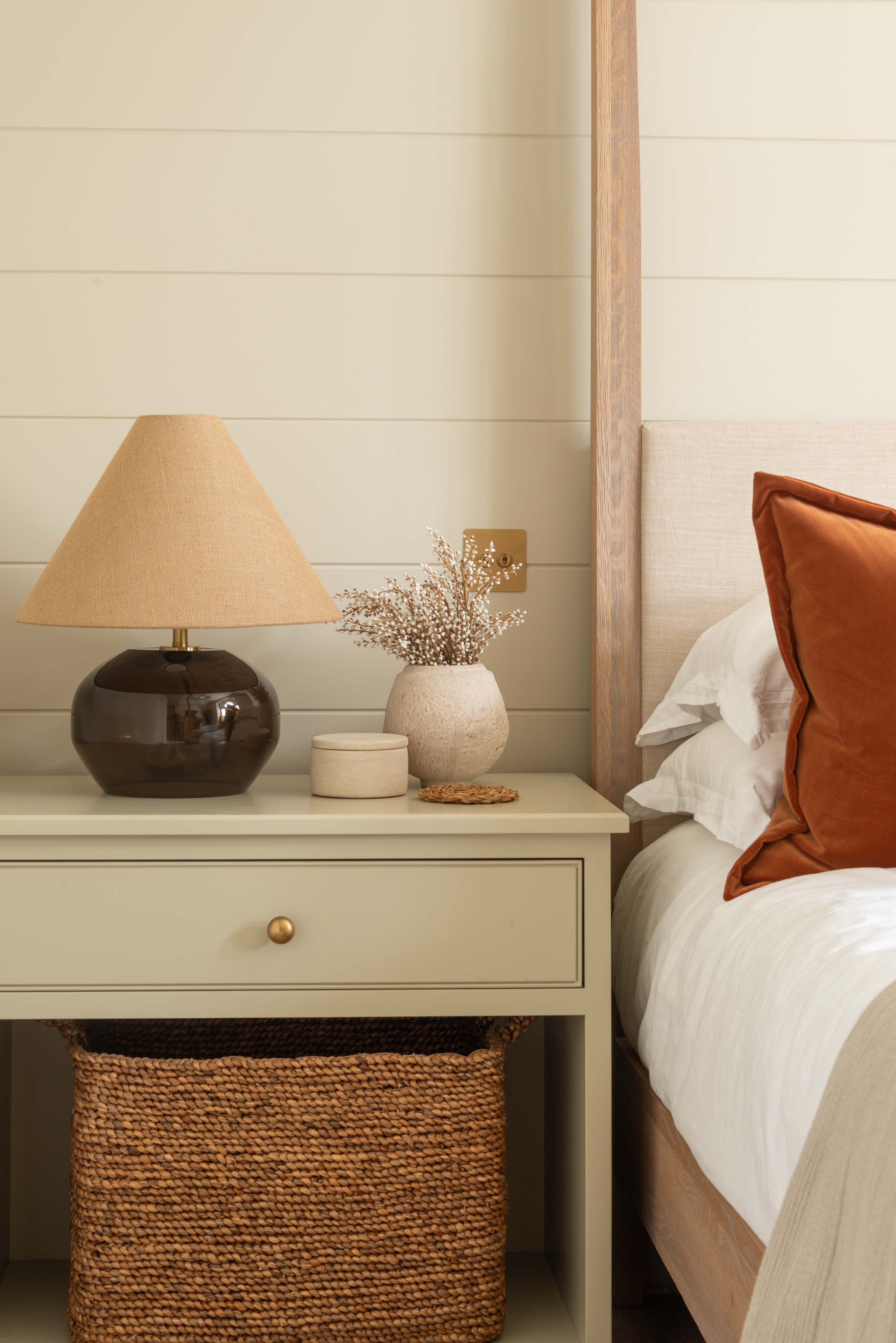 a rounded smoked amber glass base paired with a textured woven fabric shade