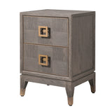 A brown bedside table with two drawers featuring brass handles, placed on a oak veneer surface with visible wood grain patterns.