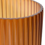Close-up of ribbed amber ombre glass vase showing textured details
