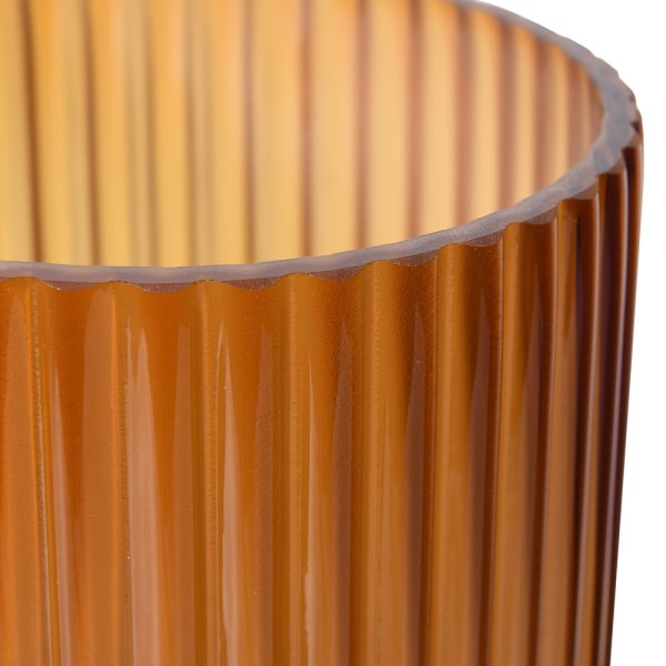 Close-up of ribbed amber ombre glass vase showing textured details