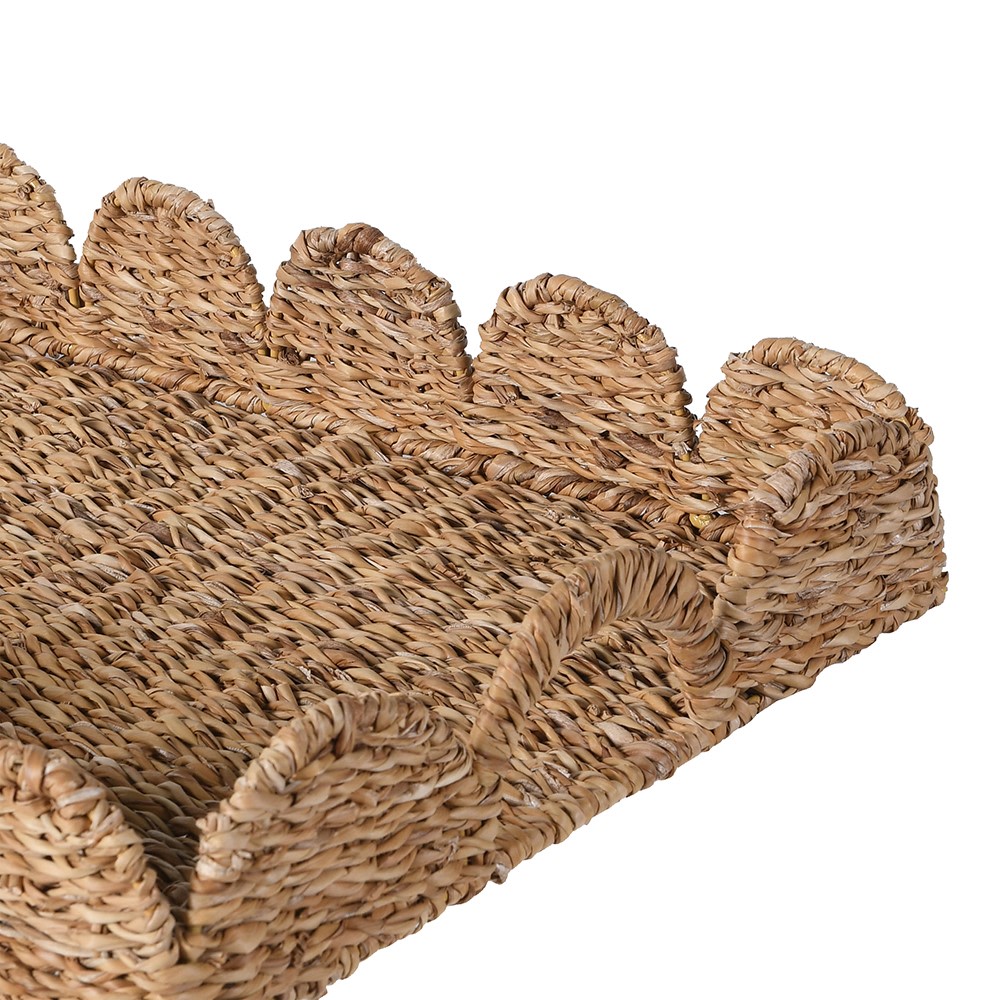 Handwoven seagrass serving tray with scalloped edges and handles CLOSE UP