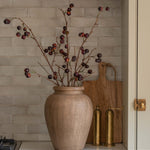 Charles Ted Faux Cherry Spray in a rustic vase styled against a tiled kitchen backsplash