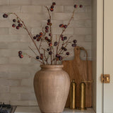 Charles Ted Faux Cherry Spray in a rustic vase styled against a tiled kitchen backsplash