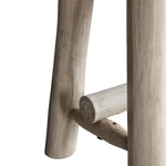 Rustic solid wood farmhouse bench with natural finish and round legs close up