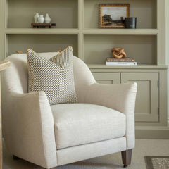 Elevate your interiors with this striking geometric cushion, expertly blending black, beige, and mustard tones for a bold, contemporary statement. On-trend and eye-catching, its intense pattern adds a dynamic edge to any space, while the sleek amber piping delivers a refined finish. Perfect for modern sofas, reading chairs, or beds, this cushion balances artistry with structure—bringing sharp style and texture into your home decor.