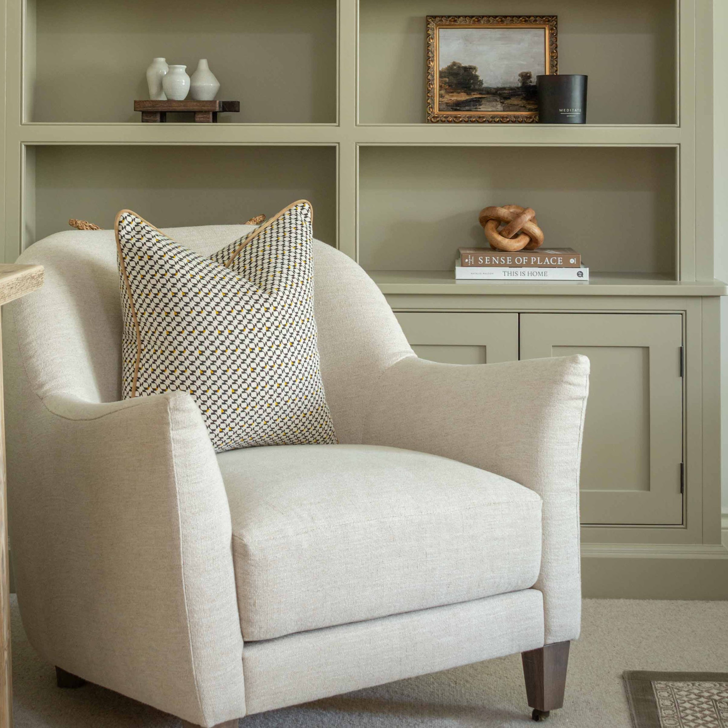 Elevate your interiors with this striking geometric cushion, expertly blending black, beige, and mustard tones for a bold, contemporary statement. On-trend and eye-catching, its intense pattern adds a dynamic edge to any space, while the sleek amber piping delivers a refined finish. Perfect for modern sofas, reading chairs, or beds, this cushion balances artistry with structure—bringing sharp style and texture into your home decor.