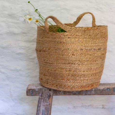 Add a touch of rustic charm to your home with our beautifully handcrafted jute basket, expertly made in India using 100% natural, sustainable jute fibers. Measuring 40cm in width and 40cm in height, this eco-friendly basket offers a perfect blend of functionality and earthy elegance.
Whether used for storage, decor, or as a unique planter, this basket brings warmth and texture to any space. Its sturdy handles make it easy to move, while its breathable, organic weave is ideal for indoor plants.
Styling Tip