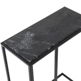 Black marble top table with metal frame on a white background