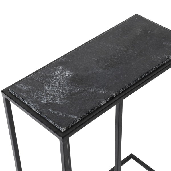 Black marble top table with metal frame on a white background