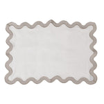 Set of four linen placemats with scalloped wave border
