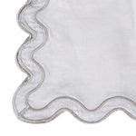 Close-up of linen placemat scalloped edge detail