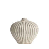 Ivory ribbed ceramic vase with rounded silhouette and modern textured design.