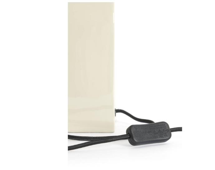 Minimalist dome shade table lamp in cream with nickel detail close up light switch