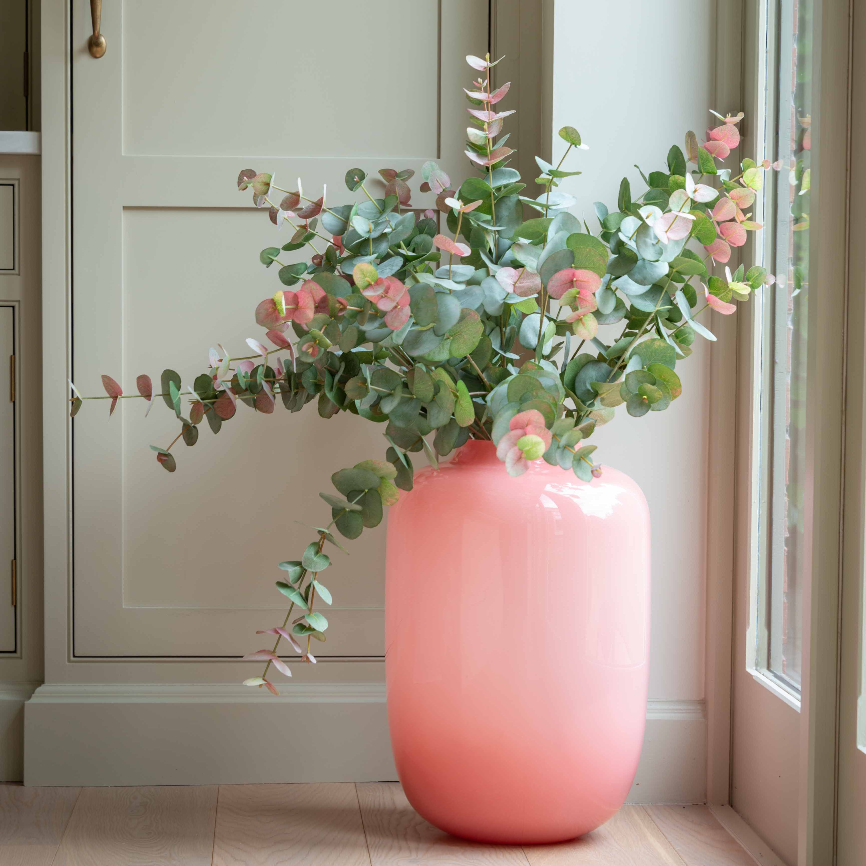 Elevate your space with this stunning pink glass vase, crafted from smooth, high-quality glass in a soft blush tone. Designed to add a touch of modern elegance, this minimalist vase is perfect for enhancing shelves, tabletops, or floor spaces with its sleek and glossy finish.
Ideal for use as a decorative statement piece or for displaying your favorite fresh or dried florals, this contemporary pink vase blends effortlessly with neutral palettes and modern home decor. Whether you're styling a chic living ro