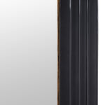 Full-length arch mirror with black frame and gold detailing close up