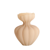 The Petal Bloom Vase is a stunning sculptural piece that brings soft elegance to any interior. Crafted from matte-finished glass in a warm beige tone, its organic silhouette mimics the gentle curves of flower petals in mid-bloom. The fluted body and wavy rim create a delicate, feminine profile—ideal as a standalone accent or for showcasing minimalist floral arrangements. A perfect blend of modern design and natural inspiration, this vase adds a touch of serene sophistication to any space.
Dimensions:
H